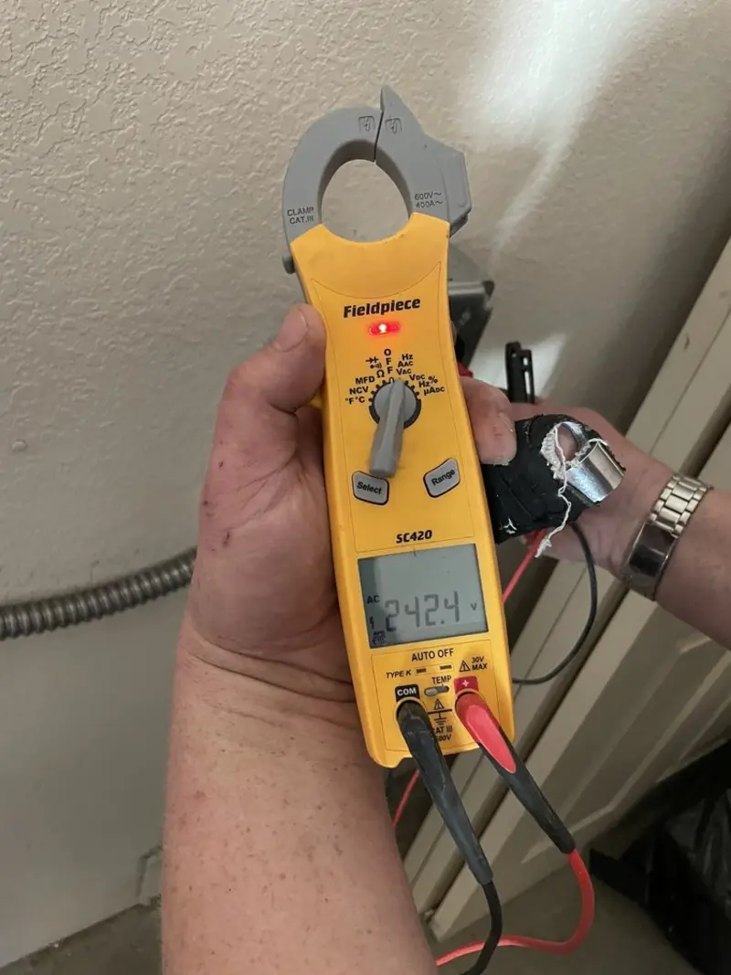 Voltage testing with clamp meter during Electrical Installation Services in Hopkinton